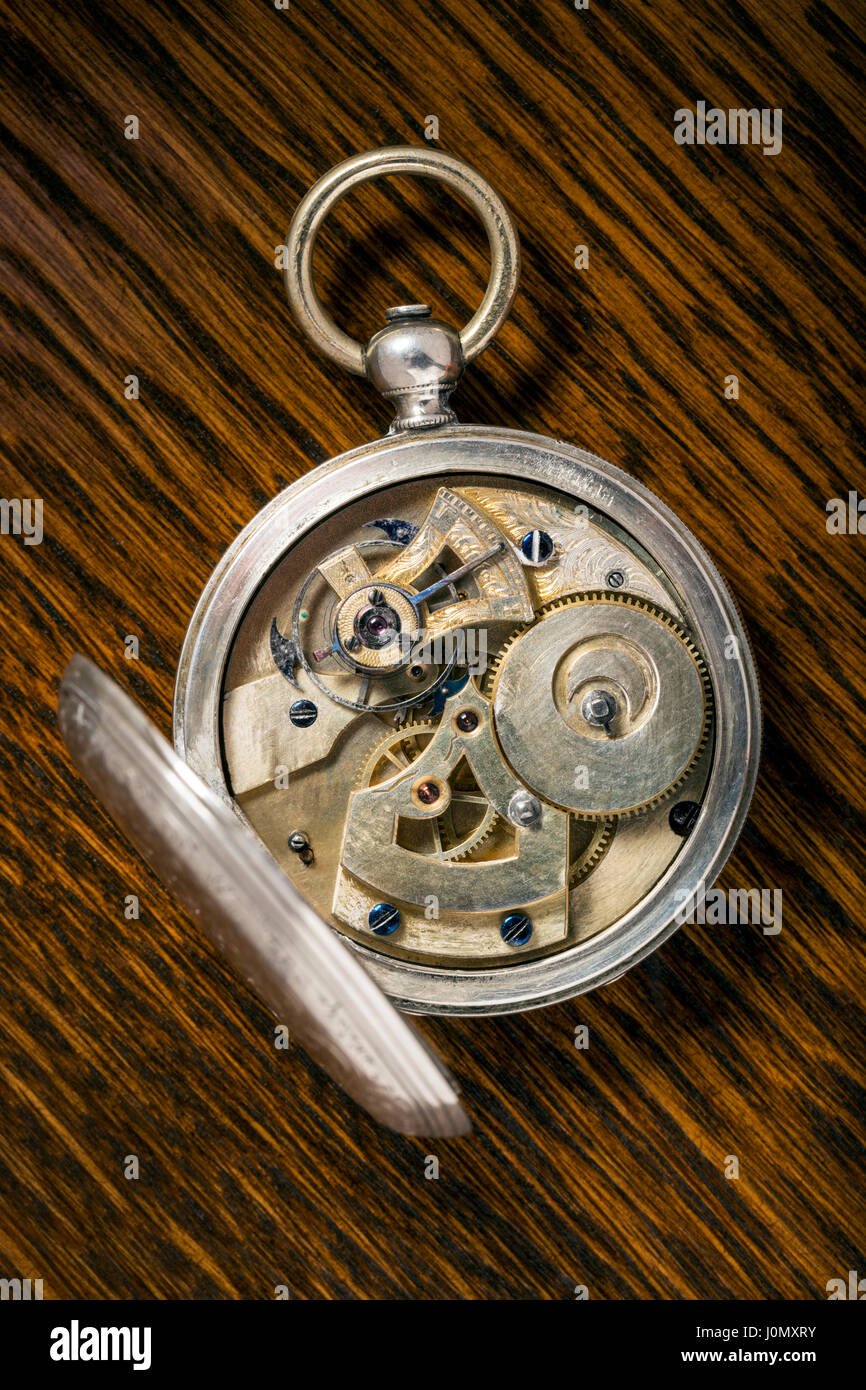 Detail of precise mechanism in antique Ami Sandoz & Fils Swiss hand carved Duplex Escapement style silver pocket watch c 1860 Stock Photo