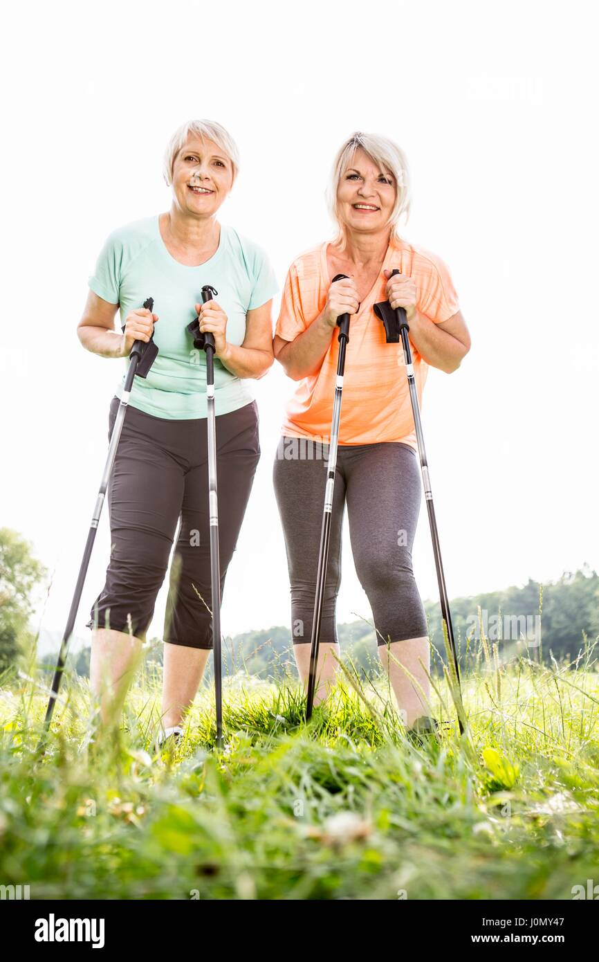 Two women with walking poles, portrait. Stock Photo