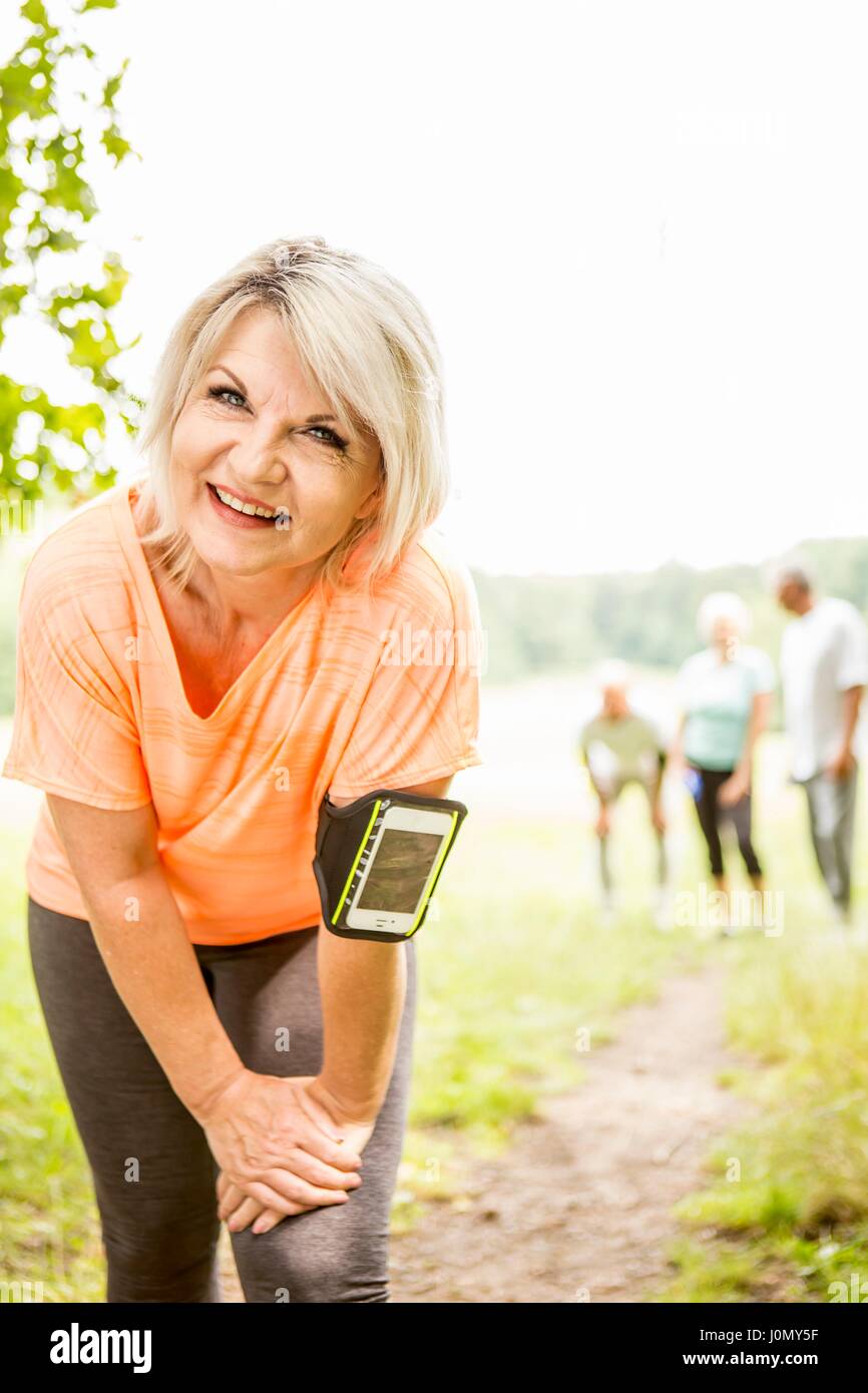Mature woman resting after exercise. Stock Photo
