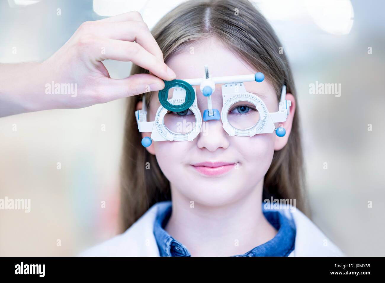 Portrait of girl wearing trial frame, close-up. Stock Photo