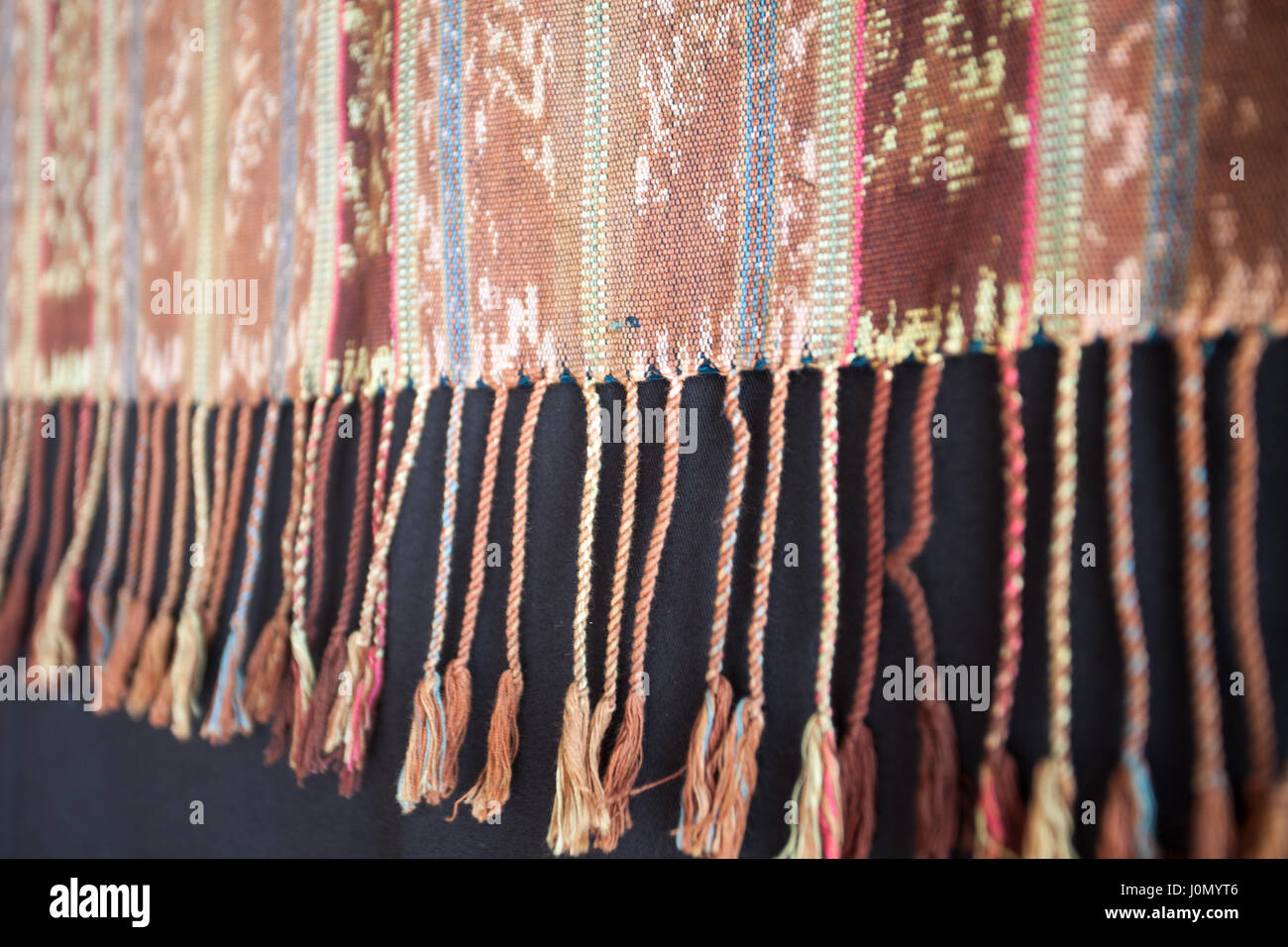 Traditional Indonesian and Asian pattern on fabric with brushes closeup and details Stock Photo