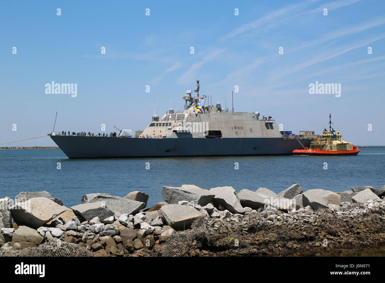 USS Milwaukee (LCS5) being towed into the harbor basin at NS Mayport