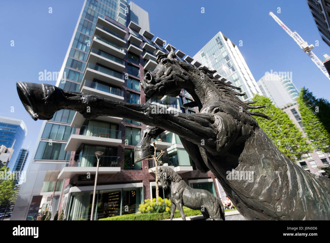 Horse sculptures by Hamish Mackie, commissioned by Berkeley Homes, for the main Piazza at Goodman’s Fields, London, UK. Stock Photo