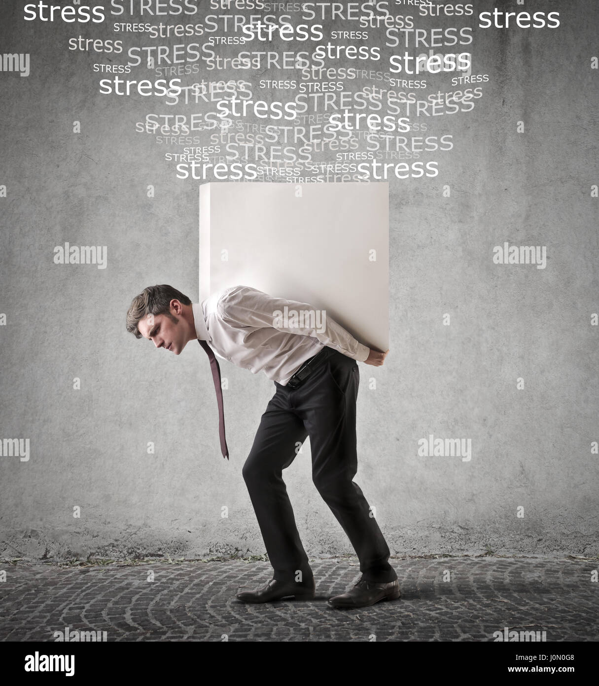 Businessman carrying heavy weight Stock Photo Alamy