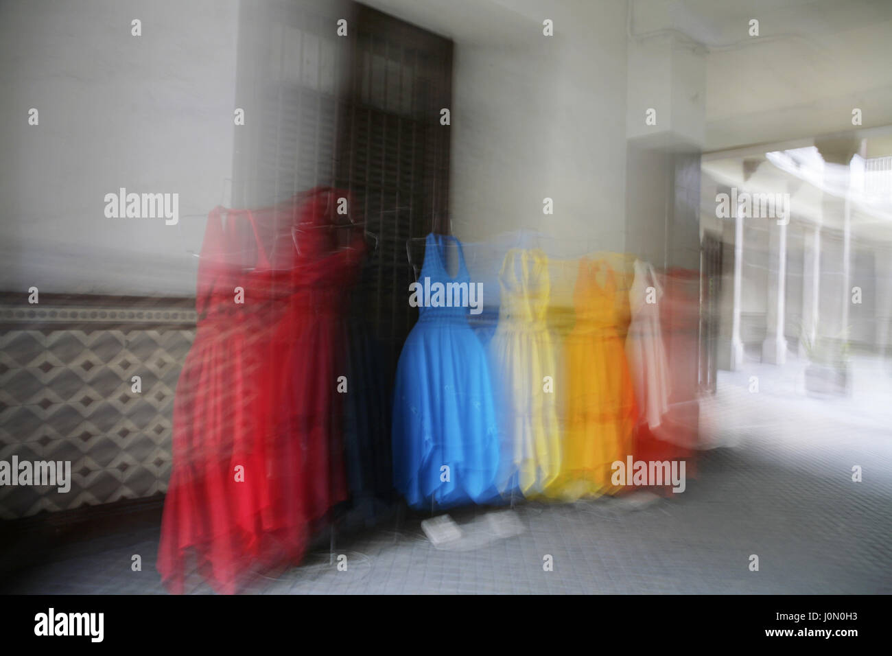 colorful dresses in old courtyard Stock Photo