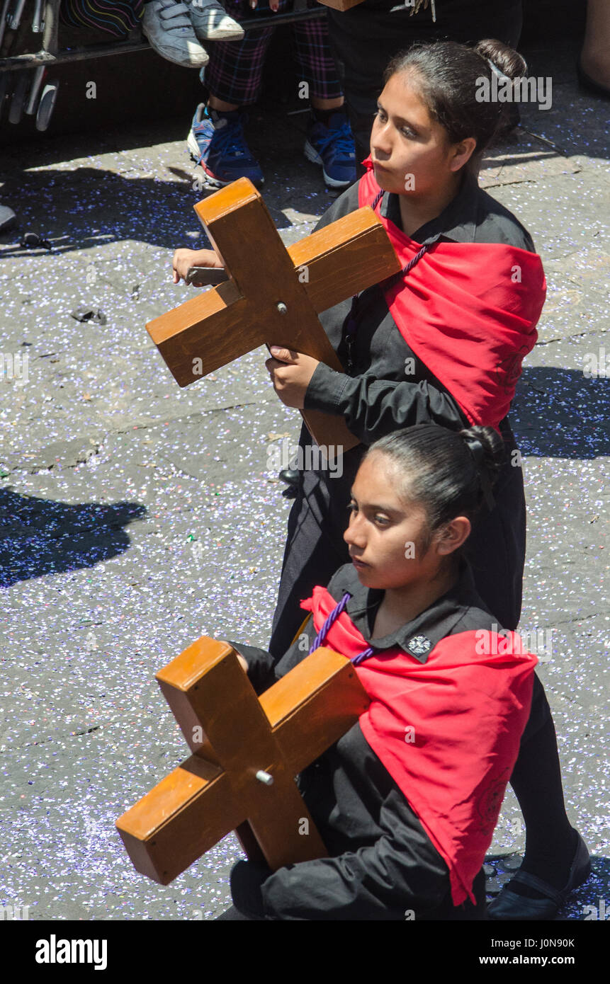 Puebla, Mexico. 14th April 2017. Catholic devotees carrying wooden crosses during the Easter procession in the centre of Puebla in Mexico. The procession is said to be the largest in Latin America and started from the cathedral. Credit: rsdphotography/Alamy Live News Stock Photo