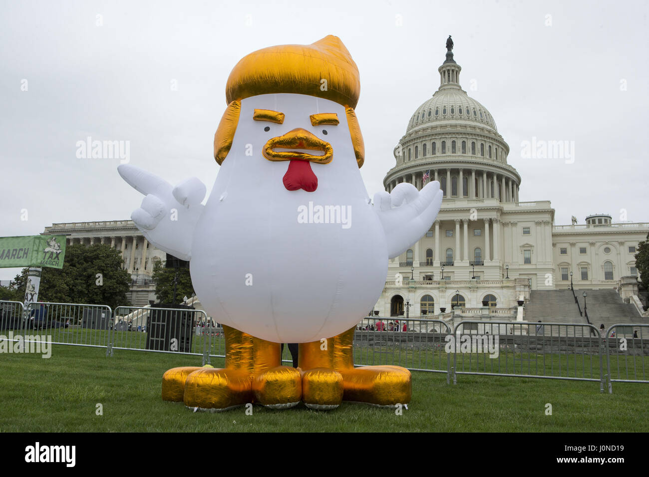 Washington, District of Columbia, USA. 15th Apr, 2017. An inflatable chicken in front of the U.S. Capitol prior to the Tax March, an effort to encourage President Donald Trump to release his taxes in Washington, DC on April 15th, 2017. Credit: Alex Edelman/ZUMA Wire/Alamy Live News Stock Photo