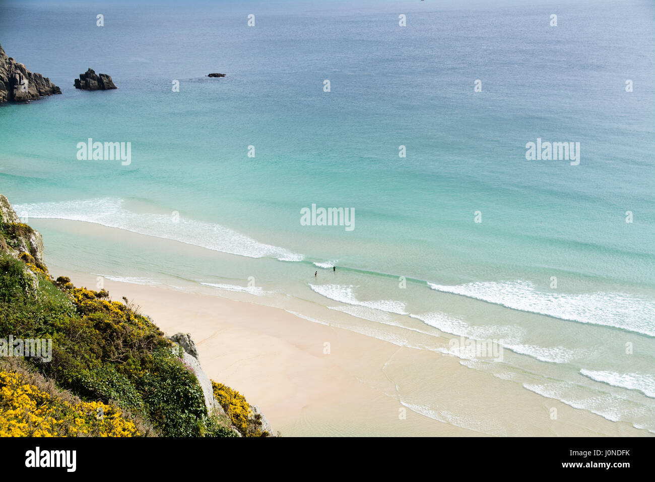 Treen, Cornwall, UK. 15th April 2017. UK Weather. A warm and sunny afternoon on the beach at Treen, and the south west coast path. With people enjoying the unspoilt beach and clear seas. Credit: cwallpix/Alamy Live News Stock Photo