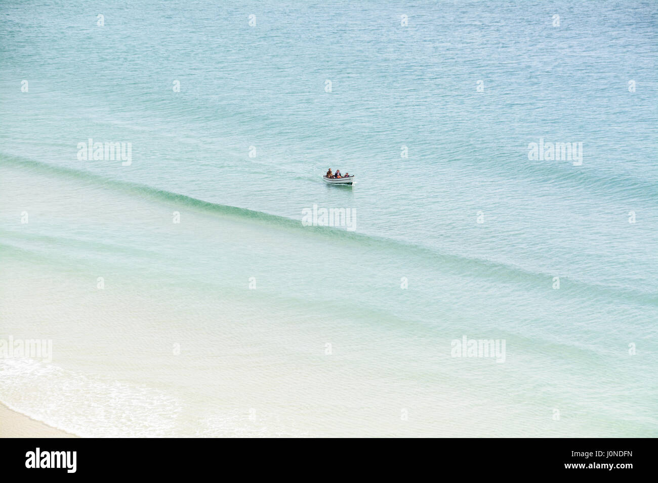 Treen, Cornwall, UK. 15th April 2017. UK Weather. A warm and sunny afternoon on the beach at Treen, and the south west coast path. With people enjoying the unspoilt beach and clear seas. Credit: cwallpix/Alamy Live News Stock Photo