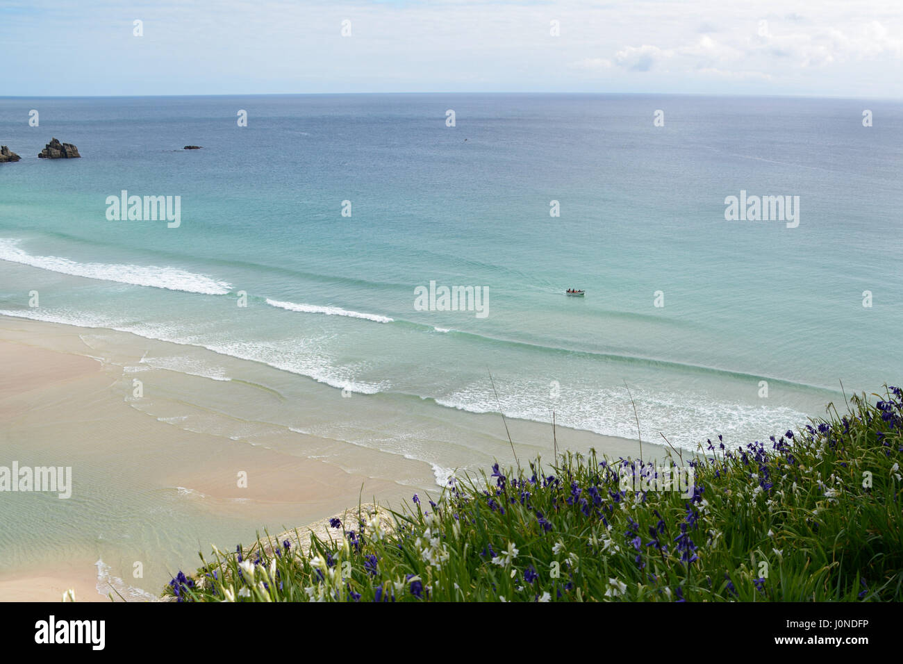 Treen, Cornwall, UK. 15th April 2017. UK Weather. A warm and sunny afternoon on the beach at Treen, and the south west coast path. With people enjoying the unspoilt beach and clear seas. Credit: cwallpix/Alamy Live News Stock Photo