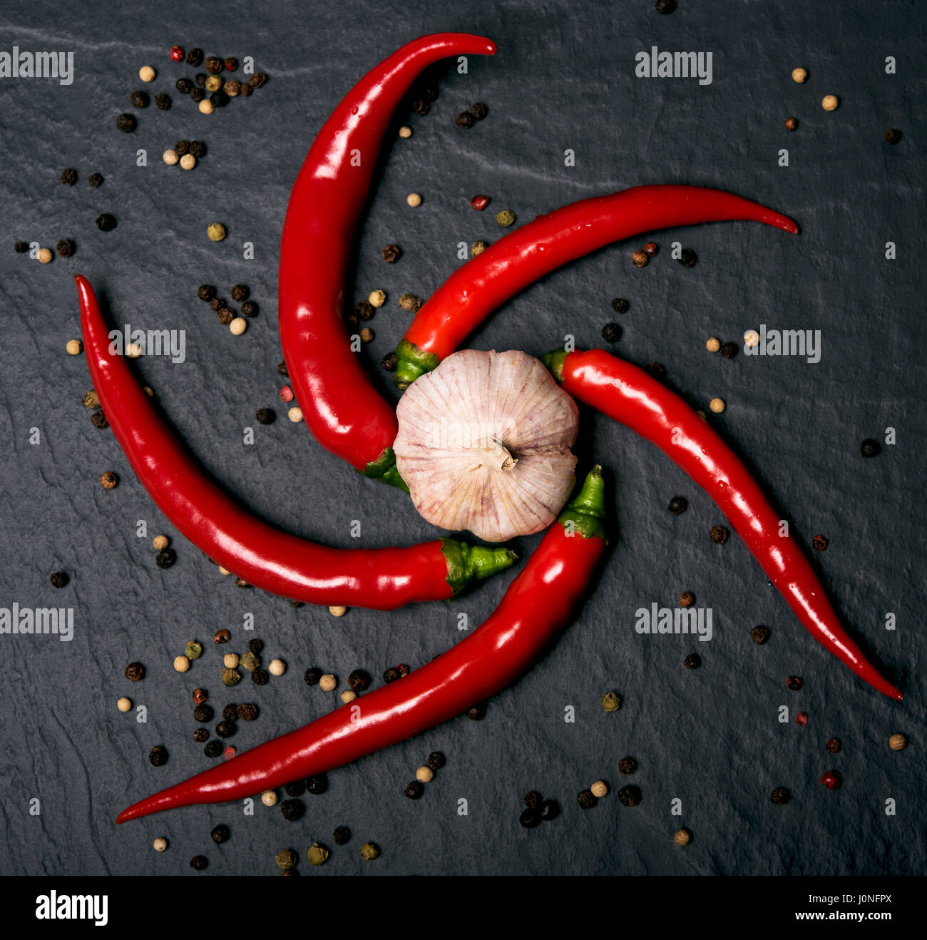 hot peppers with garlic Stock Photo - Alamy