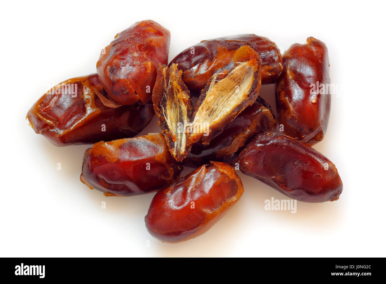 A pile of pitted dried dates on white background Stock Photo
