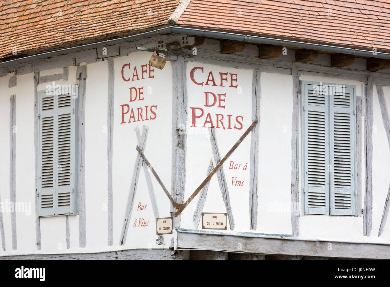 Medieval old architecture and shutters of Cafe de Paris Bar Restaurant  in 13th Century bastide town Eymet in Aquitaine, France Stock Photo