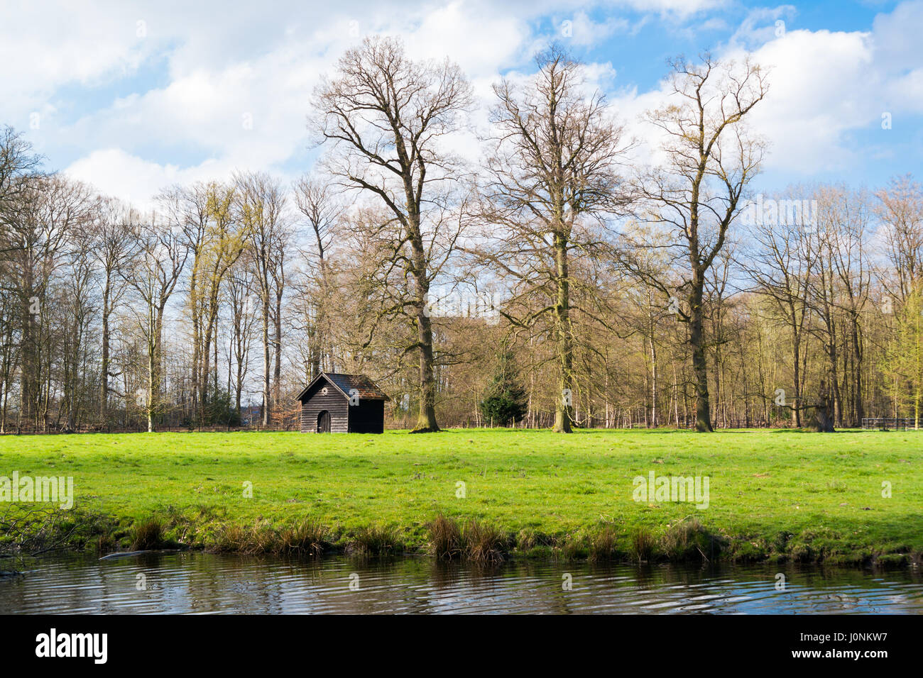 Small shed, meadow and ditch at country estate Boekesteyn, 's Graveland, North Holland, Netherlands Stock Photo