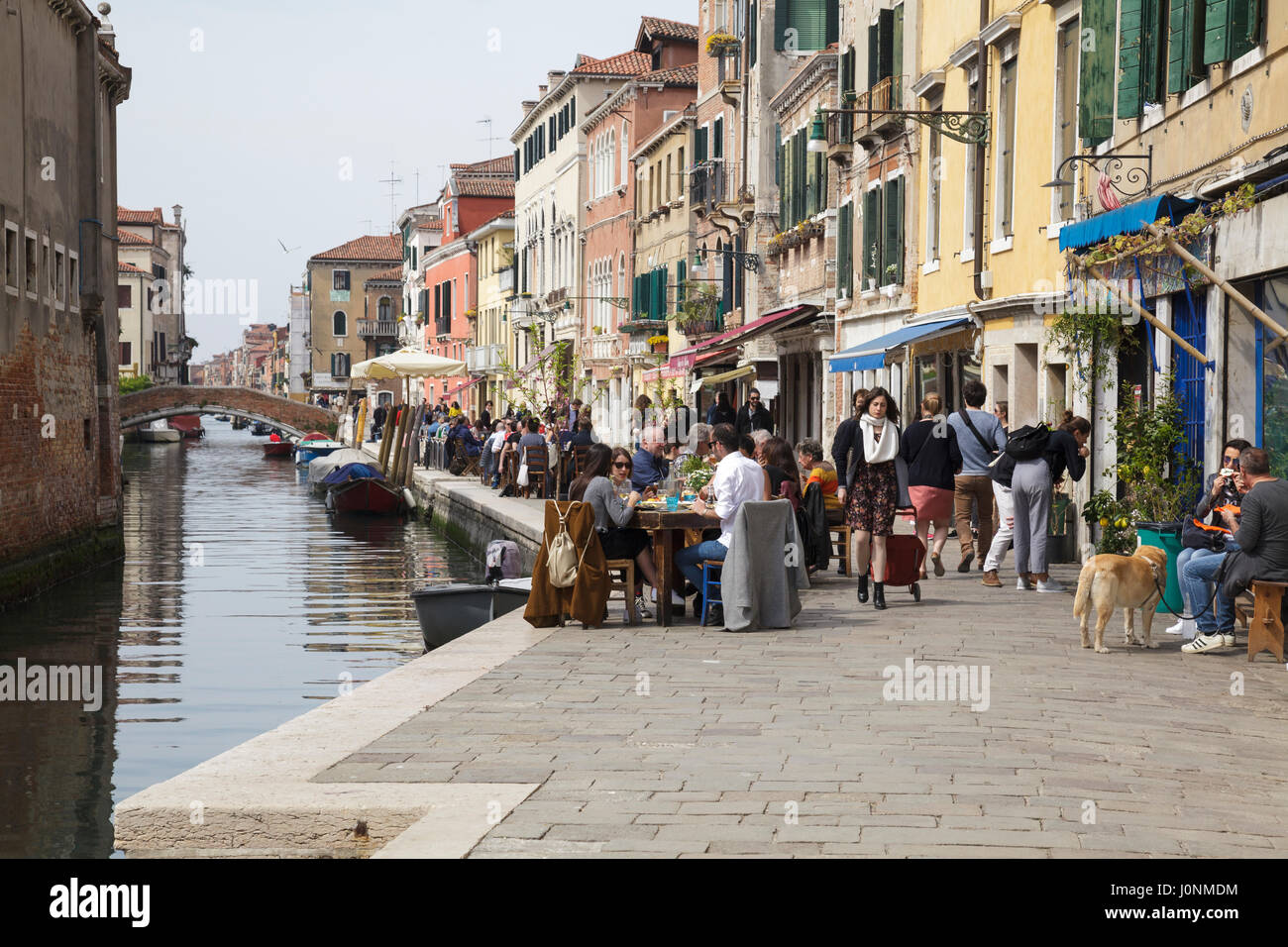 Canal side restaurant in Cannaregio, Venice, Veneto, Italy Stock Photo