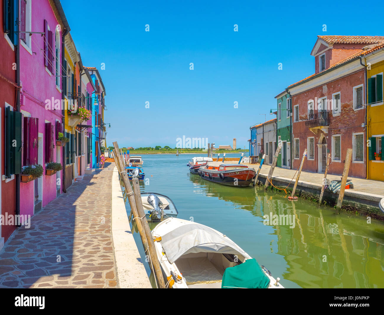 Colored buildings on channel hedge in Burano, traditional town of Venice laguna. Stock Photo