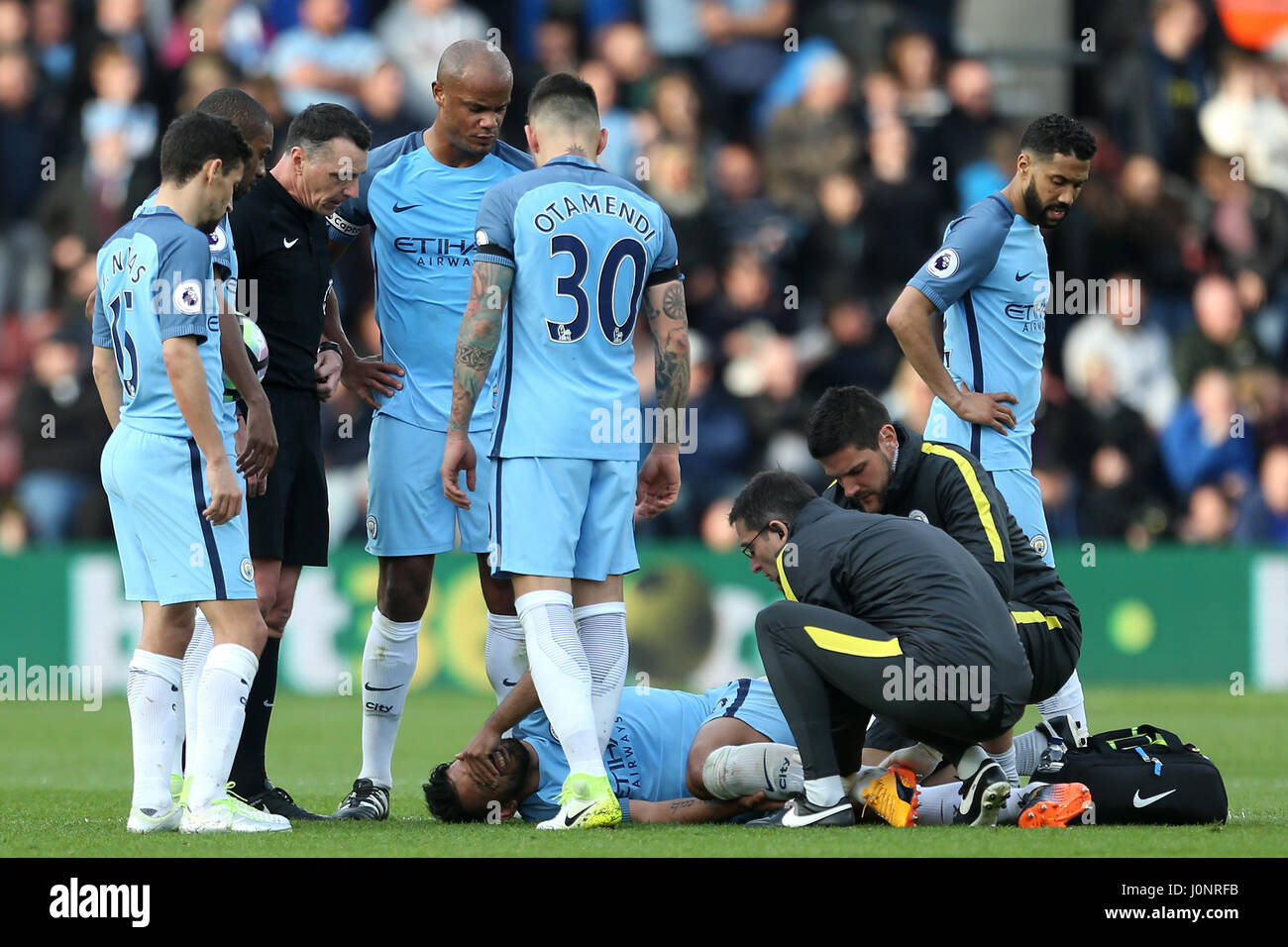 Manchester City's Sergio Aguero receives treatment to a injury during ...