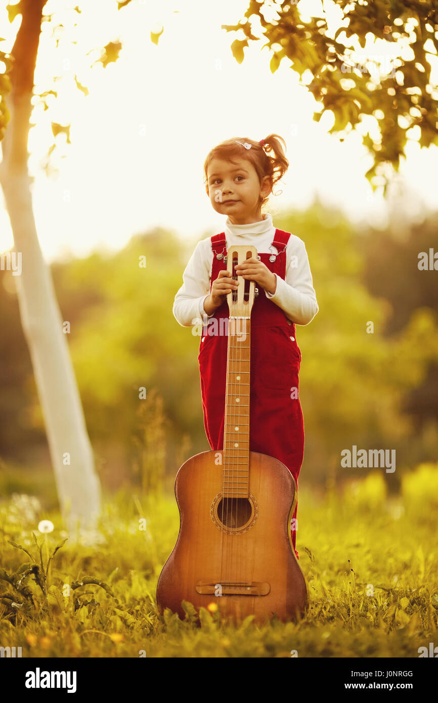 cute little girl with guitar Stock Photo