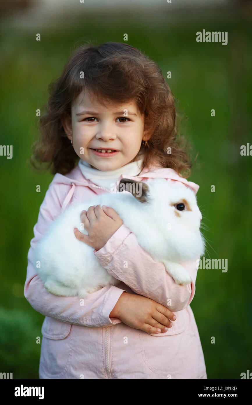 cute little girl with white rabbit Stock Photo - Alamy