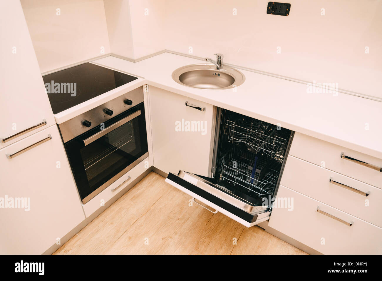 Dishwasher in the kitchen. Kitchen appliances in the apartment Stock