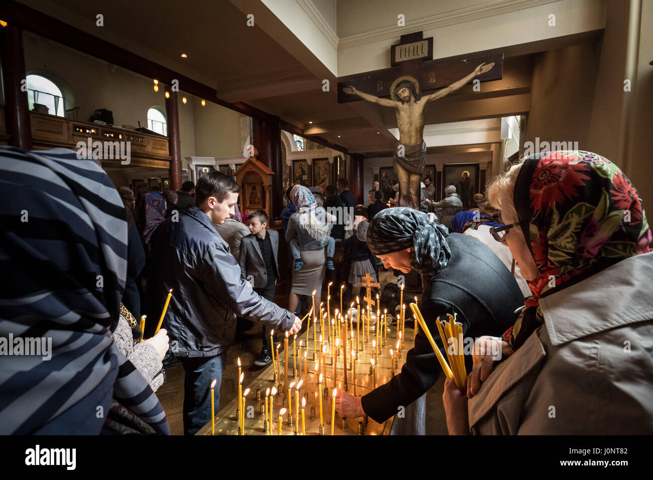 London, UK. 15th April, 2017. British based Russians and other eastern Orthodox Christians light candles and attend Easter mass inside the Russian church, Diocese of Sourozh, in London on Great Saturday. © Guy Corbishley/Alamy Live News Stock Photo
