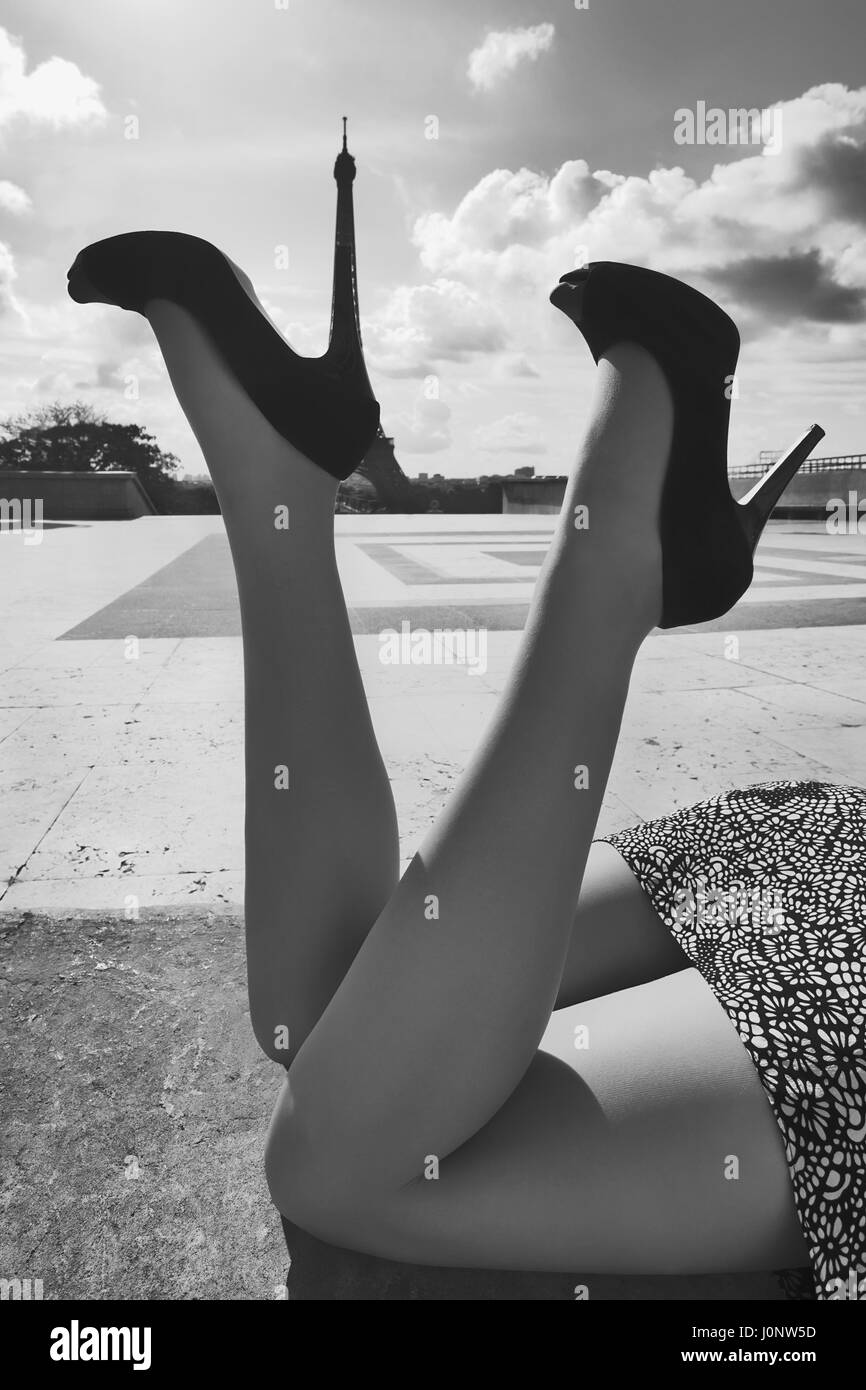 Female legs in shoes with high heels on background Eiffel Tower in Paris. France Stock Photo