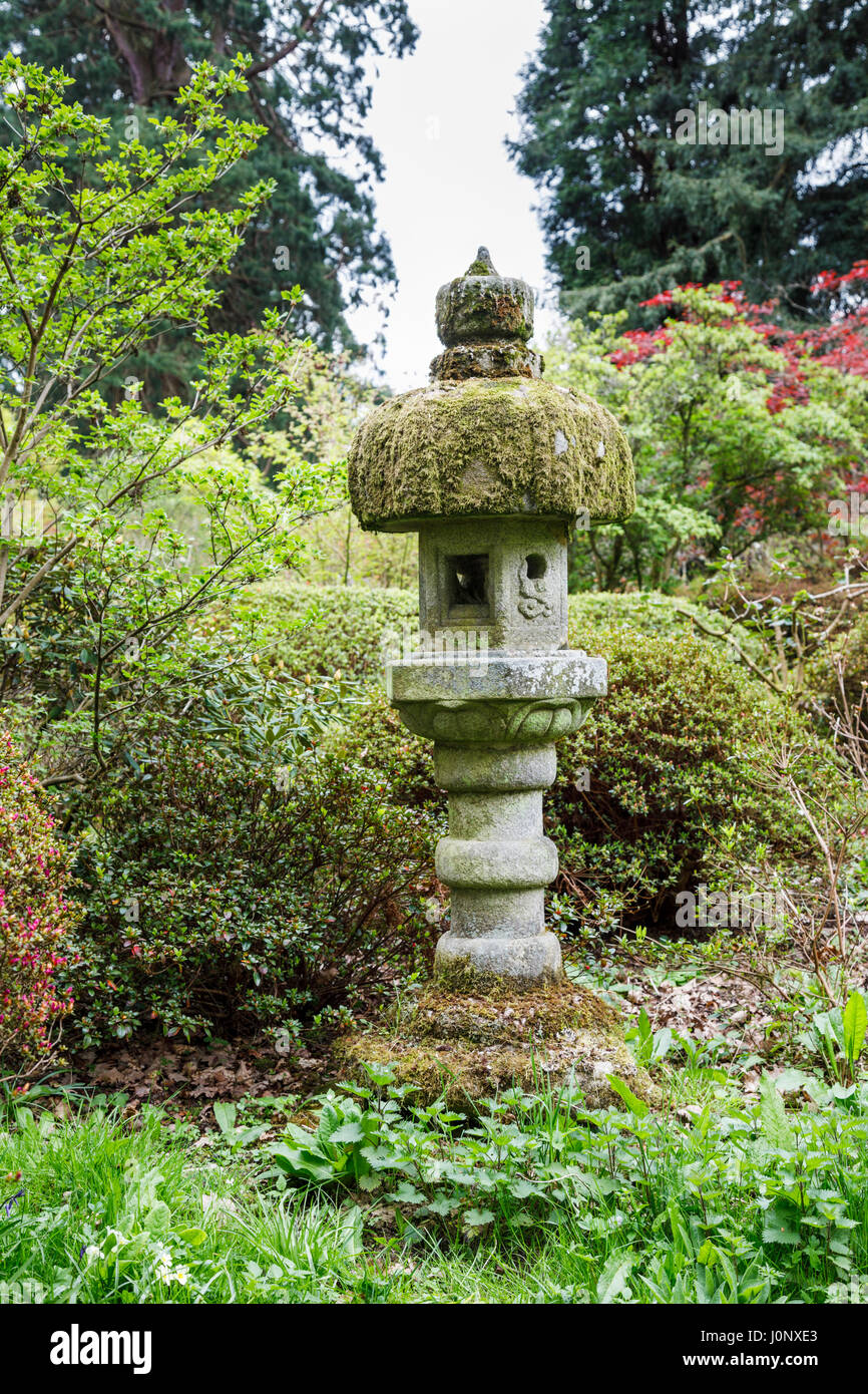 Moss-covered stone garden ornament, Ramster Garden near Chiddingfold, Surrey, south-east England, UK Stock Photo