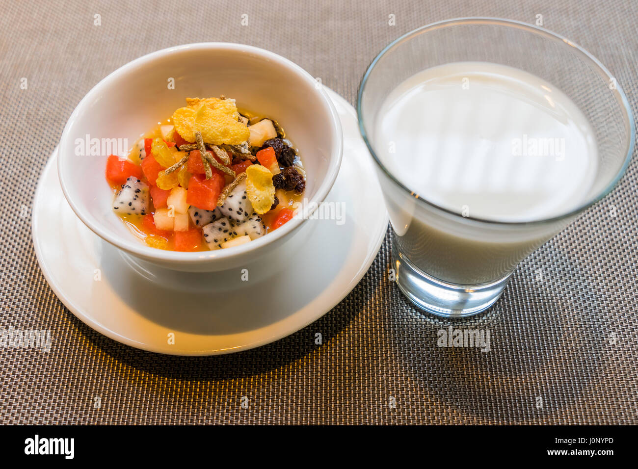 Useful homemade fruits salad, bowl of cereal and healthy breakfast with Milk Stock Photo