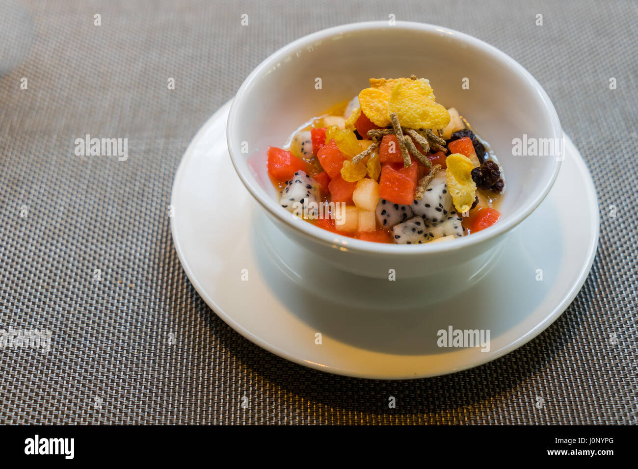 Useful homemade fruits salad, bowl of cereal and healthy breakfast Stock Photo