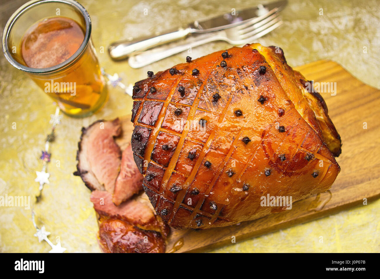 Roasted ham with apricot glaze and cloves Stock Photo Alamy