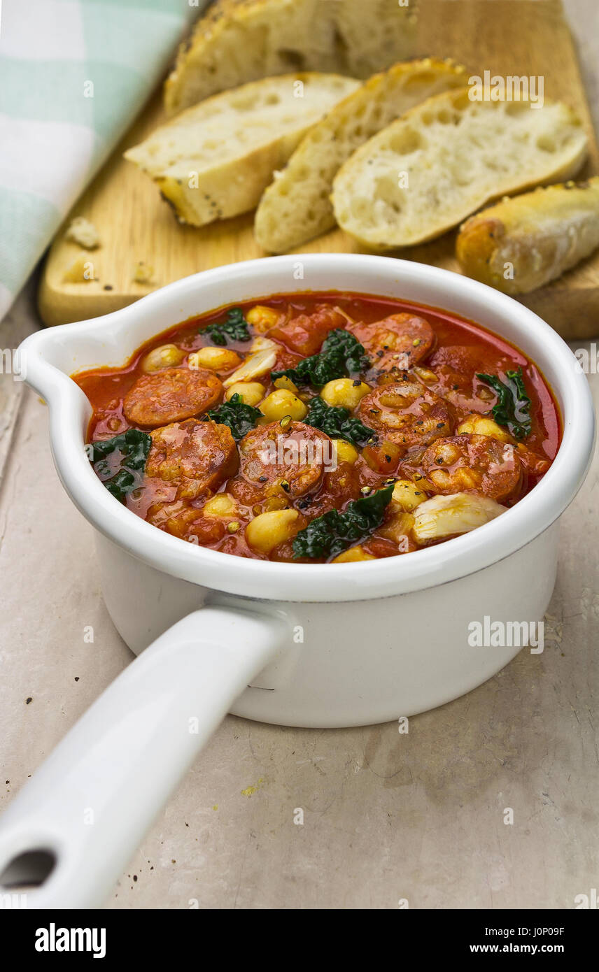 Chorizo kale chickpea soup with fresh bread Stock Photo Alamy