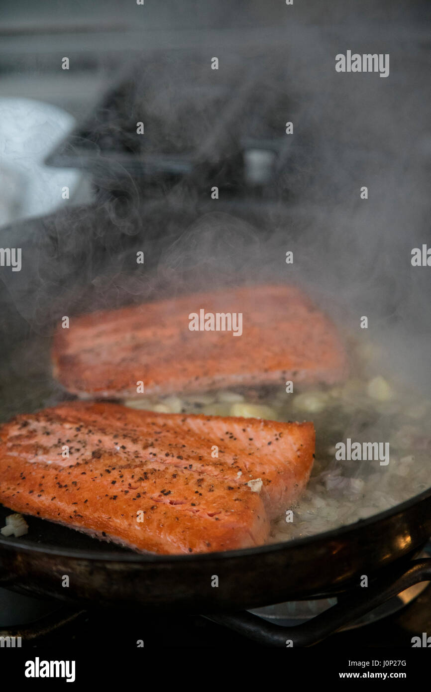Cooking salmon, Talon Lodge, Sitka, Alaska Stock Photo