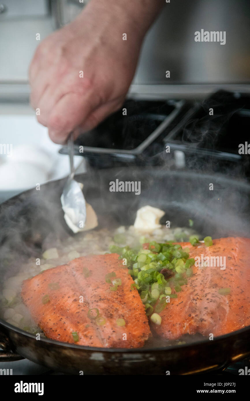Cooking salmon, Talon Lodge, Sitka, Alaska Stock Photo