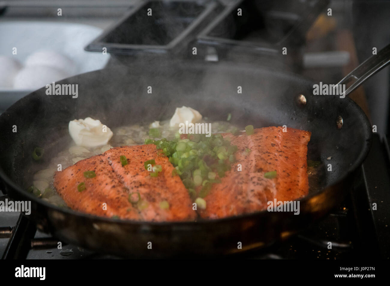 Cooking salmon, Talon Lodge, Sitka, Alaska Stock Photo