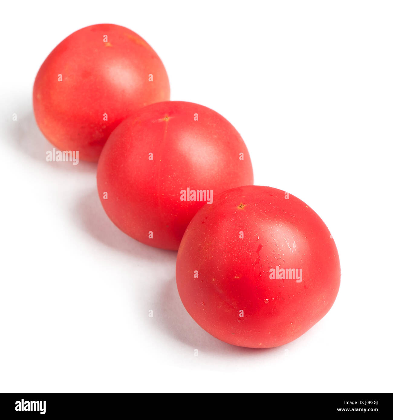 Tomatoes isolated on white background Stock Photo - Alamy