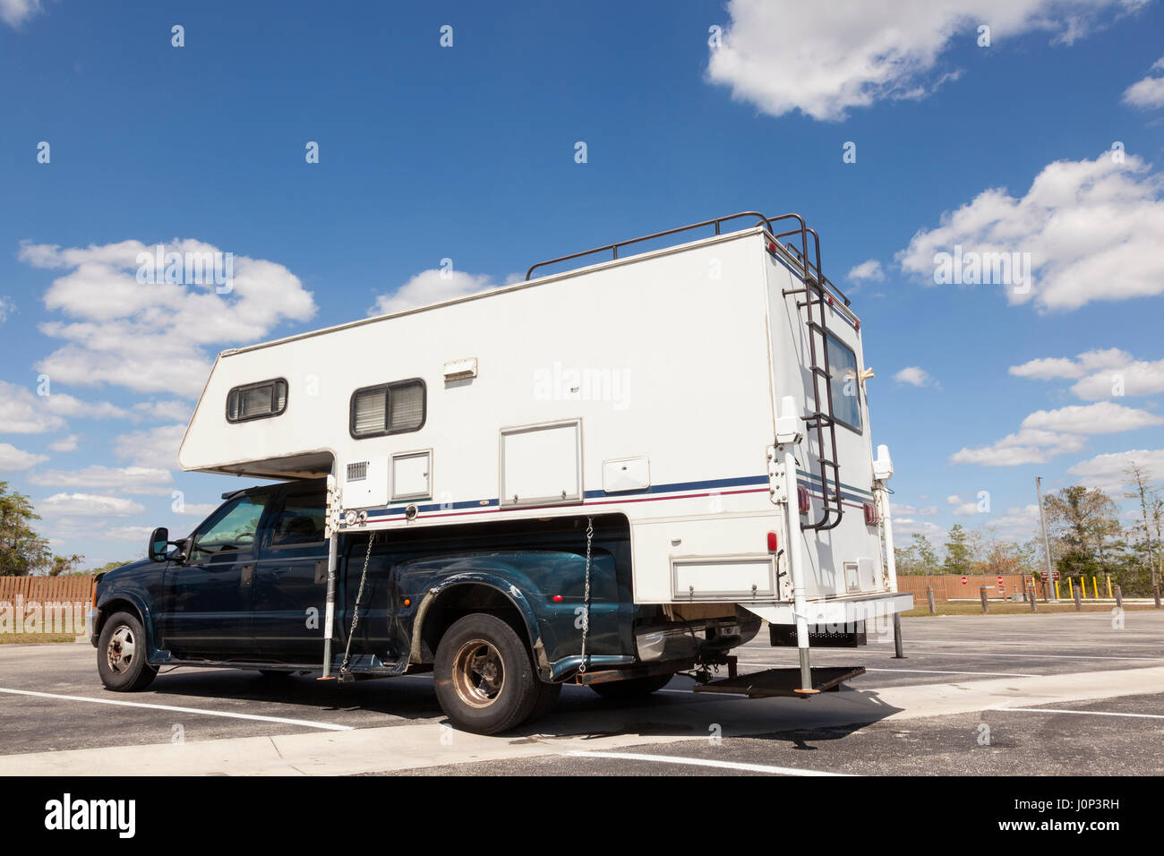 Older recreational vehicle at the parking lot in Everglades National Park. Florida, United States Stock Photo