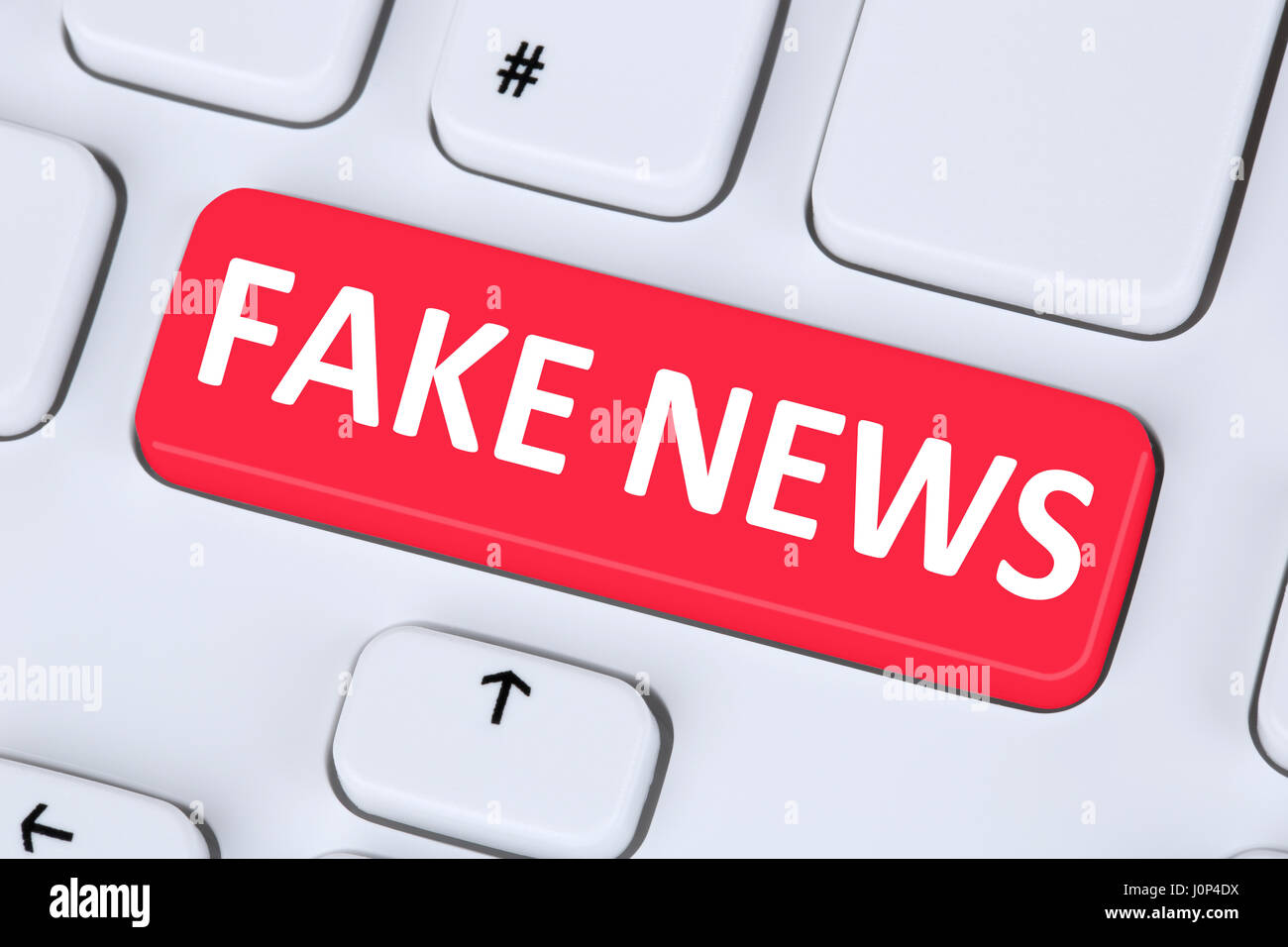 Fake news truth lie media internet button online computer keyboard symbol Stock Photo