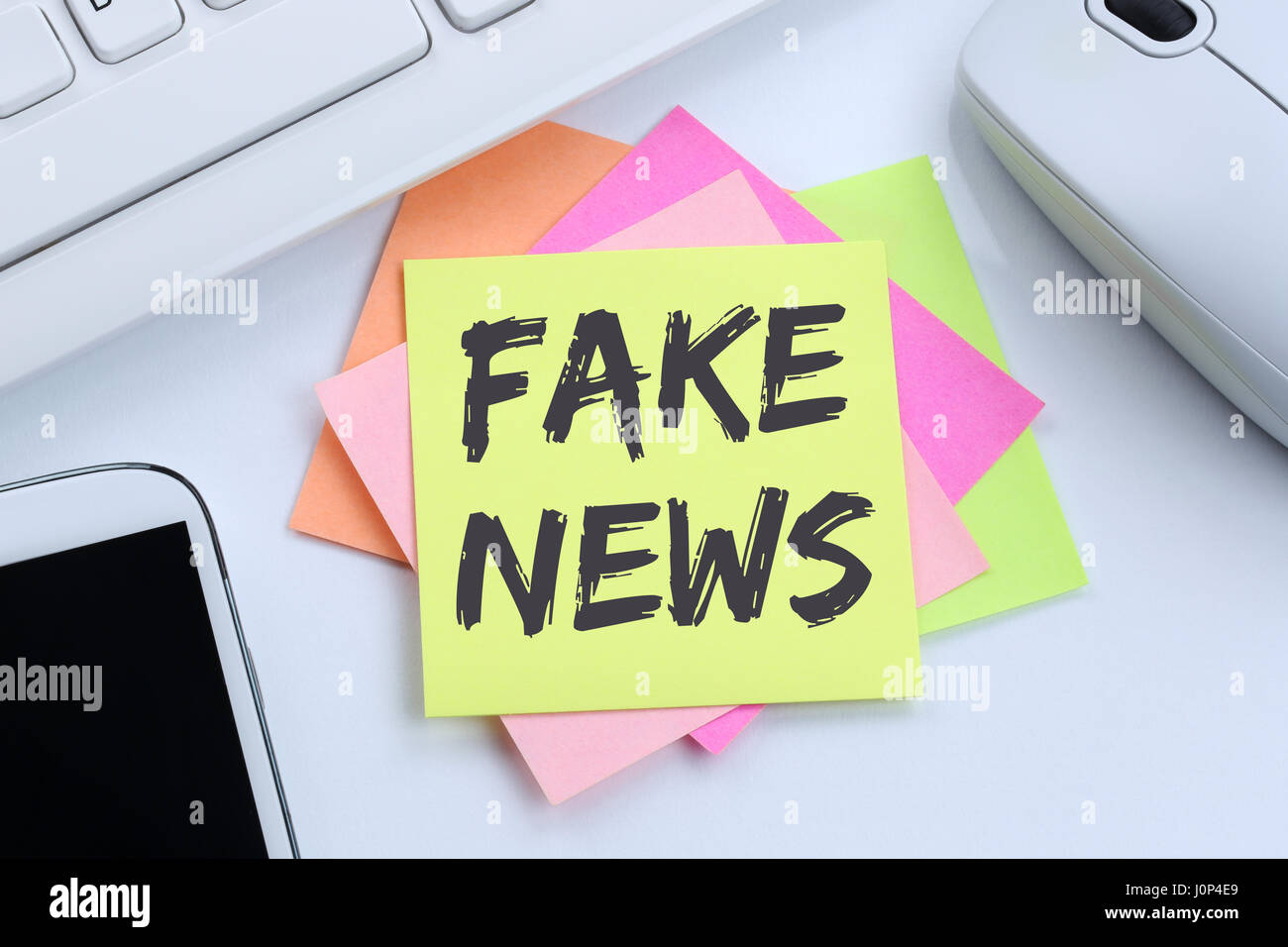 Fake news truth lie media internet online office desk computer Stock Photo
