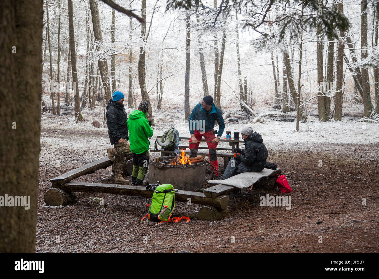 OUTDOOR LIFE AROUND THE FIRE PREPARING FOR GRILL Stock Photo