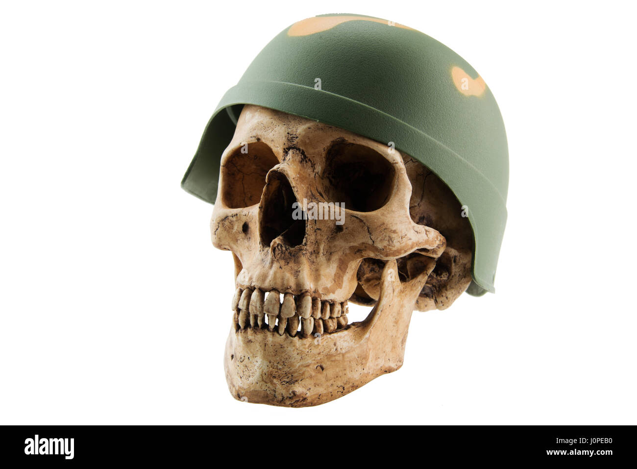 Human skull in soldier helmet on white isolated background,Concept with Halloween Stock Photo
