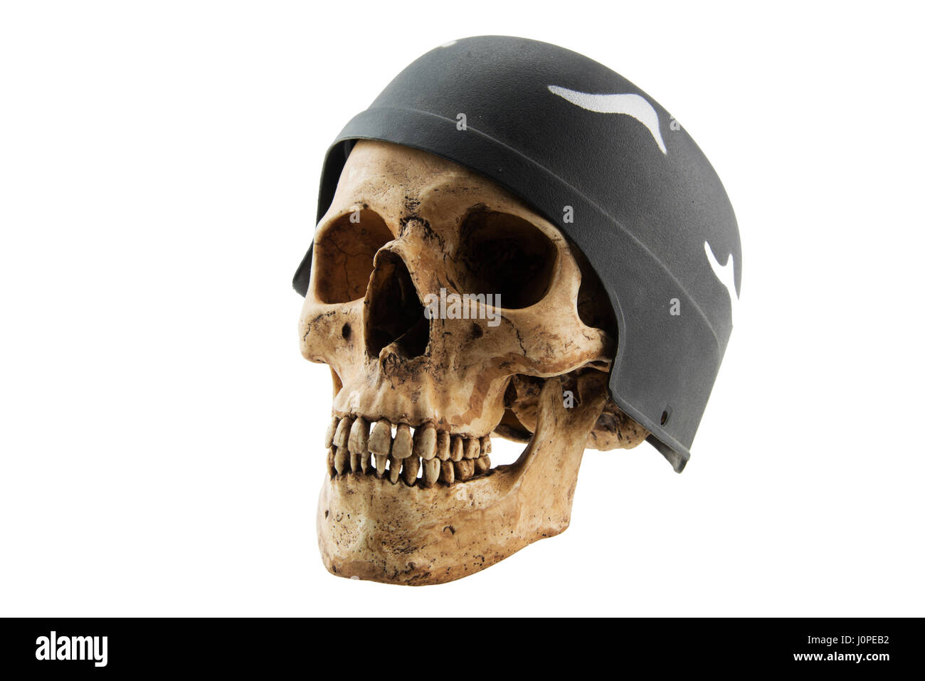 Human skull in soldier helmet on white isolated background,Concept with Halloween Stock Photo