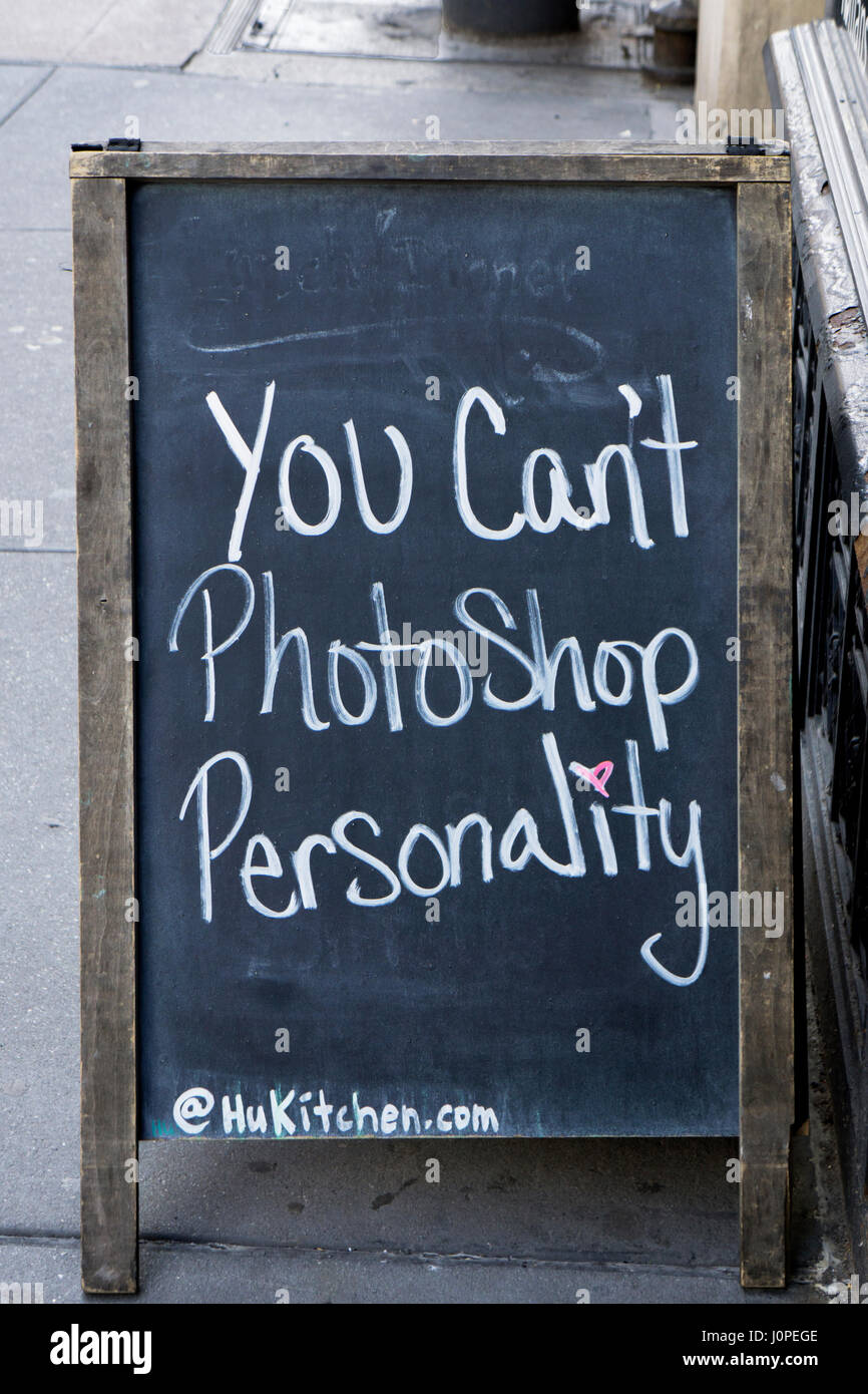 A sign outside a restaurant on Fifth Avenue in Greenwich Village saying that you Can't Photoshop Personality. In Manhattan, New York City. Stock Photo