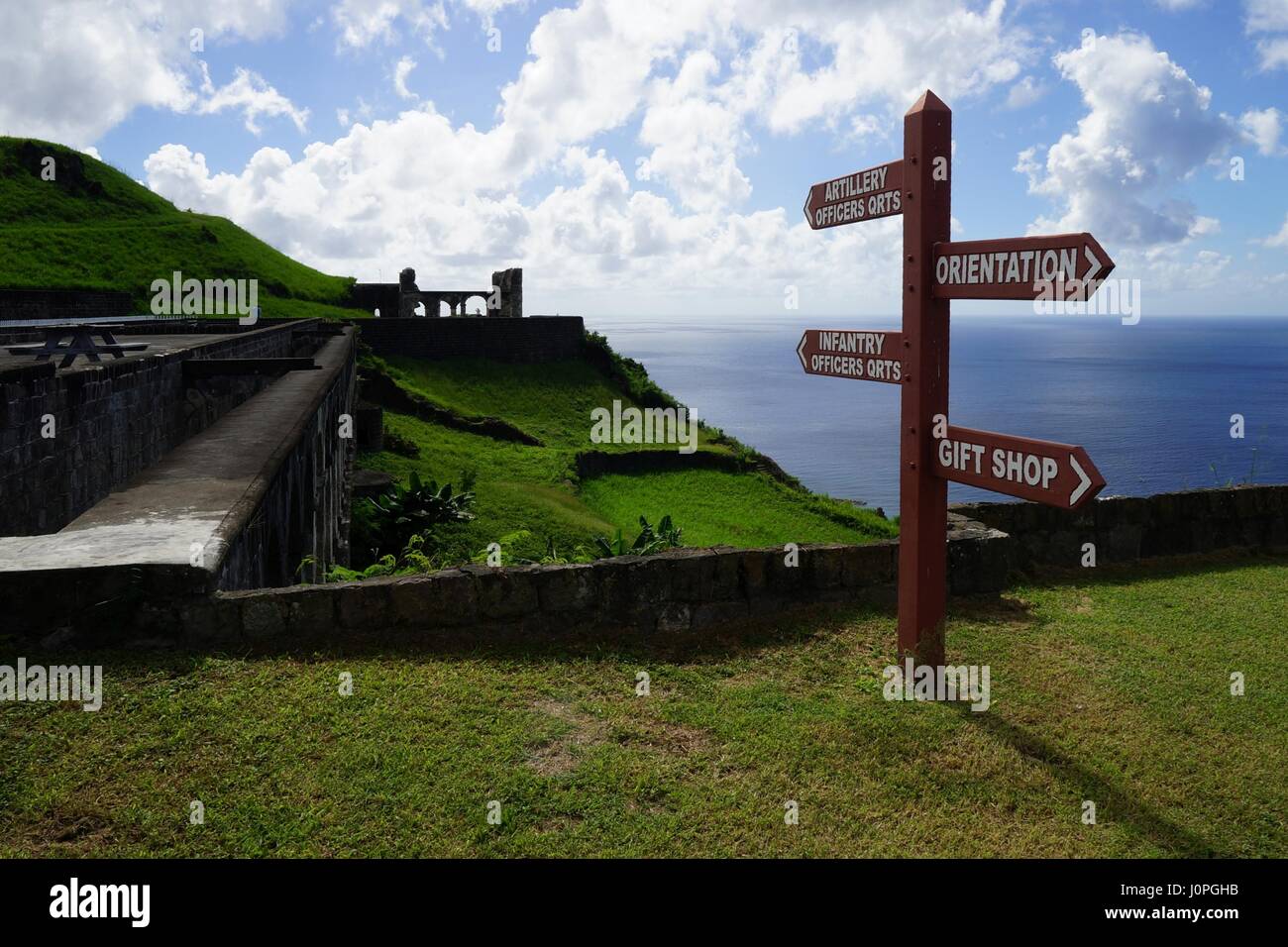 Brimstone Hill Fortress sign with ruins and sea at the background. Stock Photo