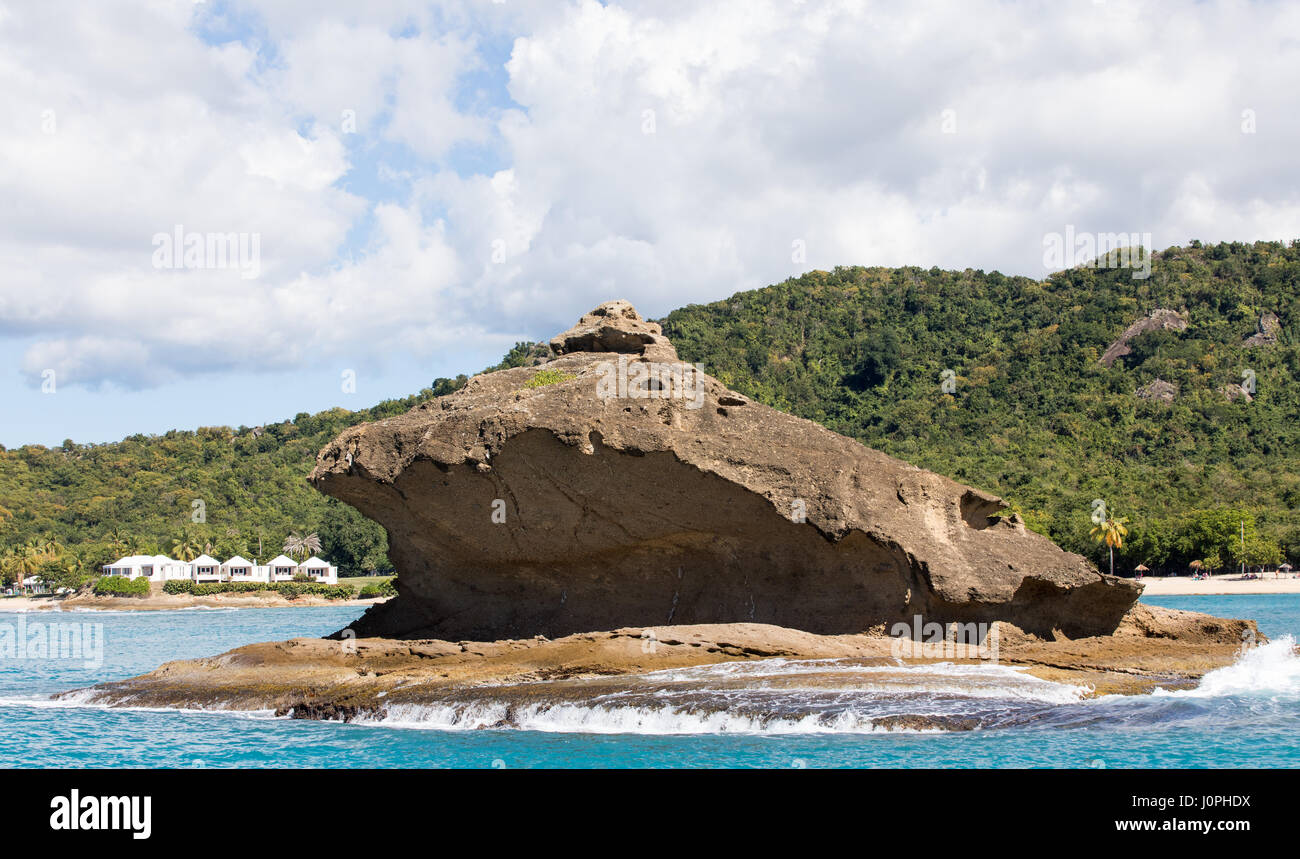 Hawksbill Rock is a rock formation off the west coast of Antigua near the town of Five Islands Village.  The name originated from its similarity to the Hawksbill Turtle. Stock Photo