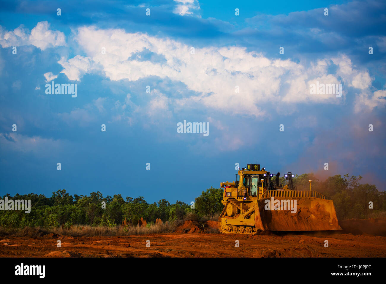 A CAT bulldozer strip mining in Far North Queensland Stock Photo