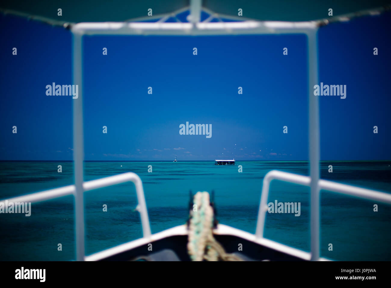 A dive boat looks out on the Great Barrier Reef near Cairns, Queensland Stock Photo