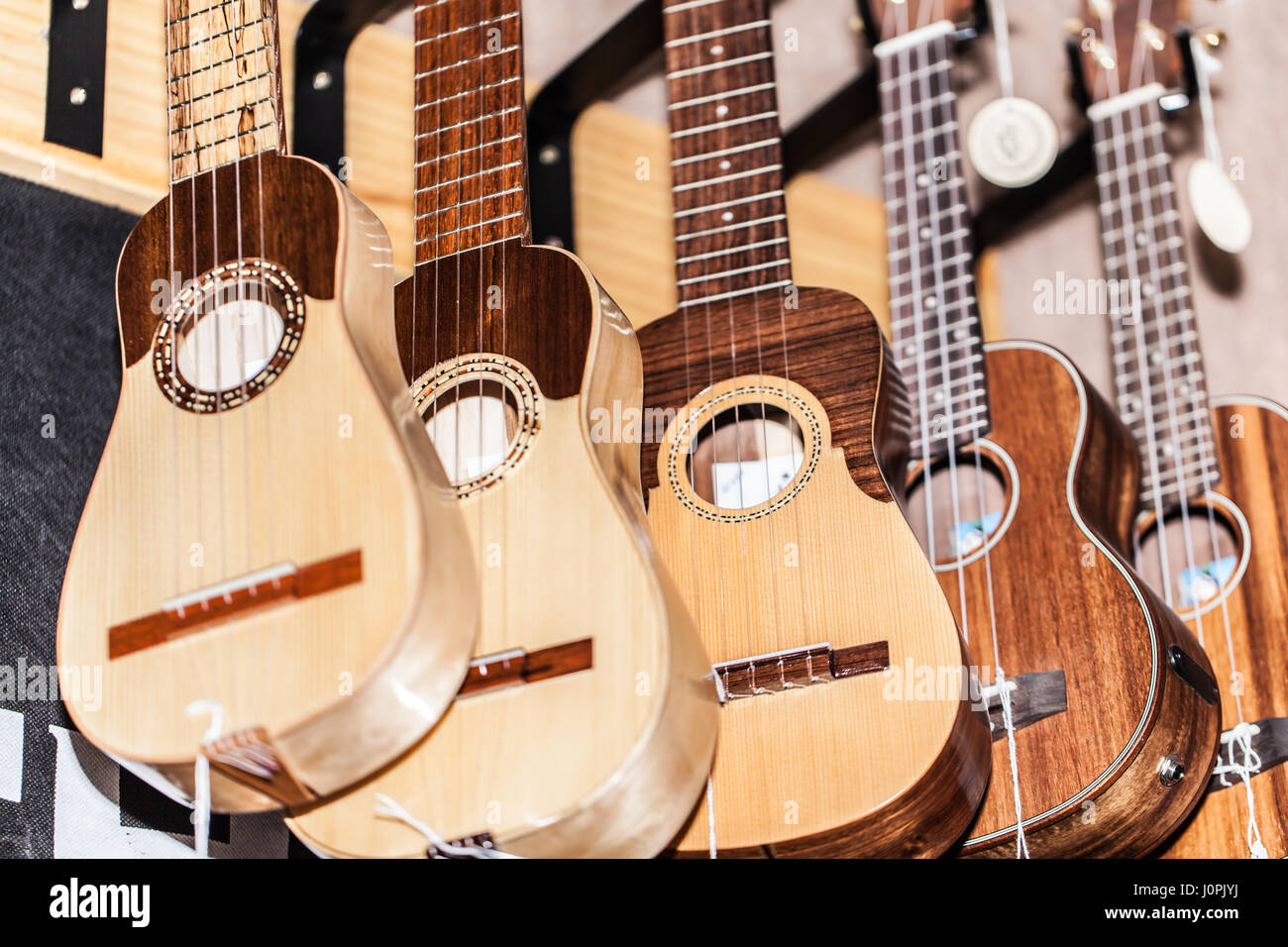 TIMPLE INSTRUMENTS for sale hanging in a music shop Stock Photo Alamy