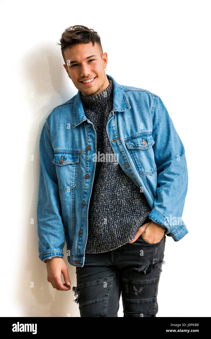 Smiling asian-white young man wearing denim jacket Stock Photo