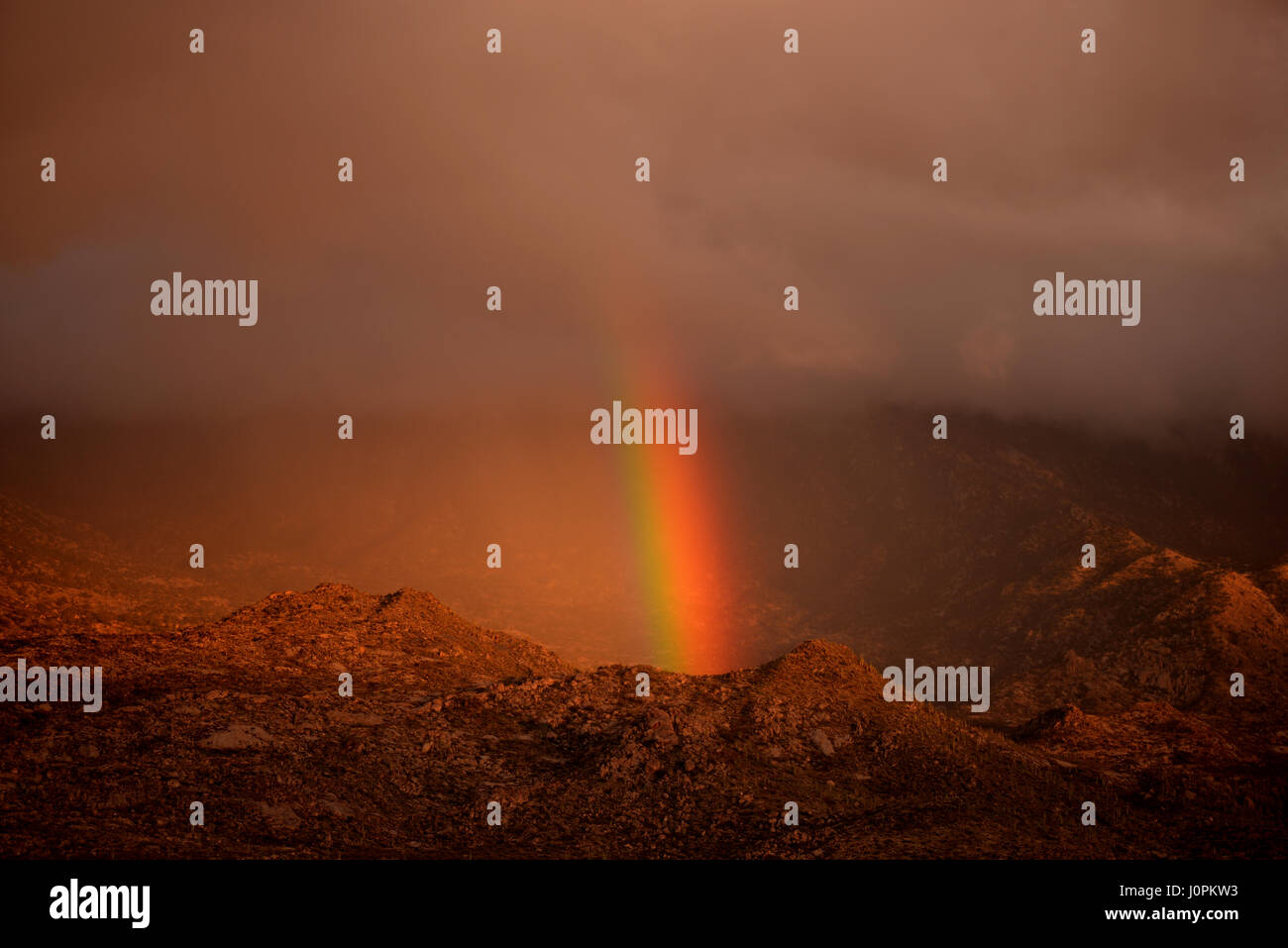 A rainbow develops over the Santa Catalina Mountains, Sonoran Desert ...