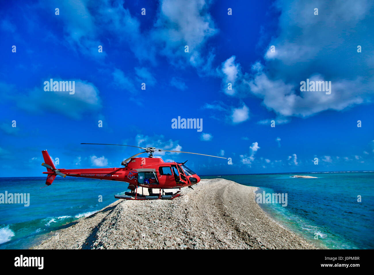A tourist helicopter sitting on one of The Great Barrier Reef´s disappearing islands Stock Photo